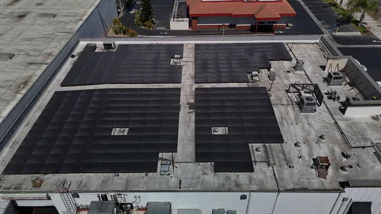 Commercial solar panel grid layout viewed from elevated drone position